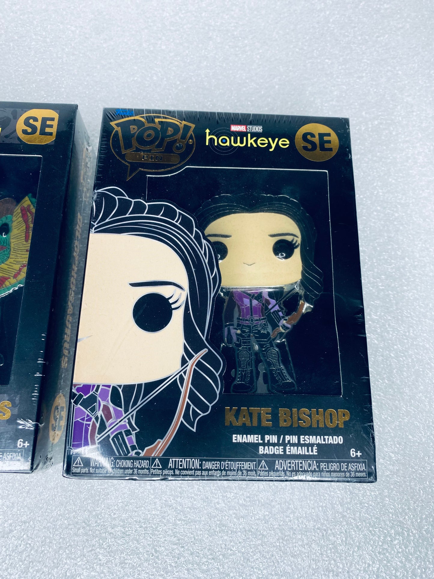 #66 - lot Of 2 - New Funko Pop Pins, Jurassic Park & Marvels Hawkeye - (READ) - (IN CONDITION AS SHOWN)