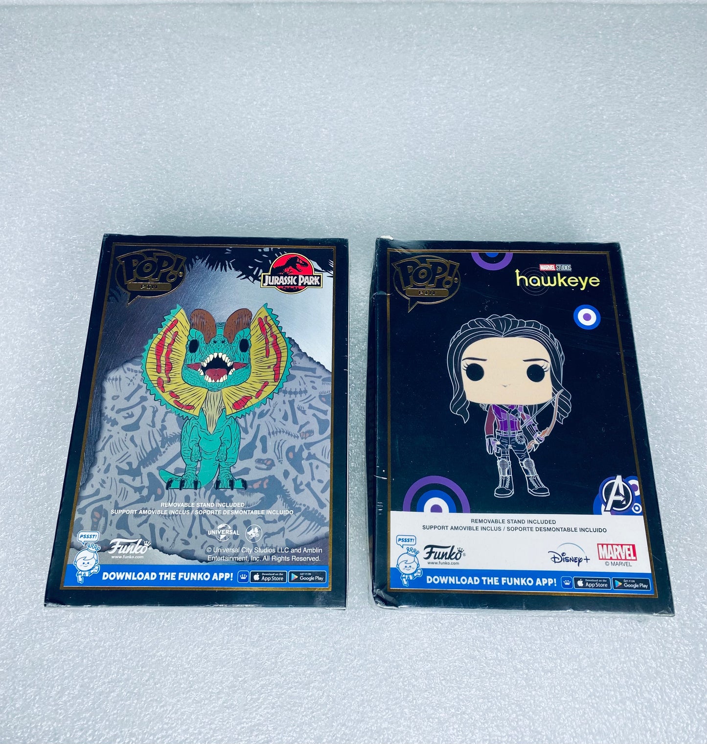 #66 - lot Of 2 - New Funko Pop Pins, Jurassic Park & Marvels Hawkeye - (READ) - (IN CONDITION AS SHOWN)