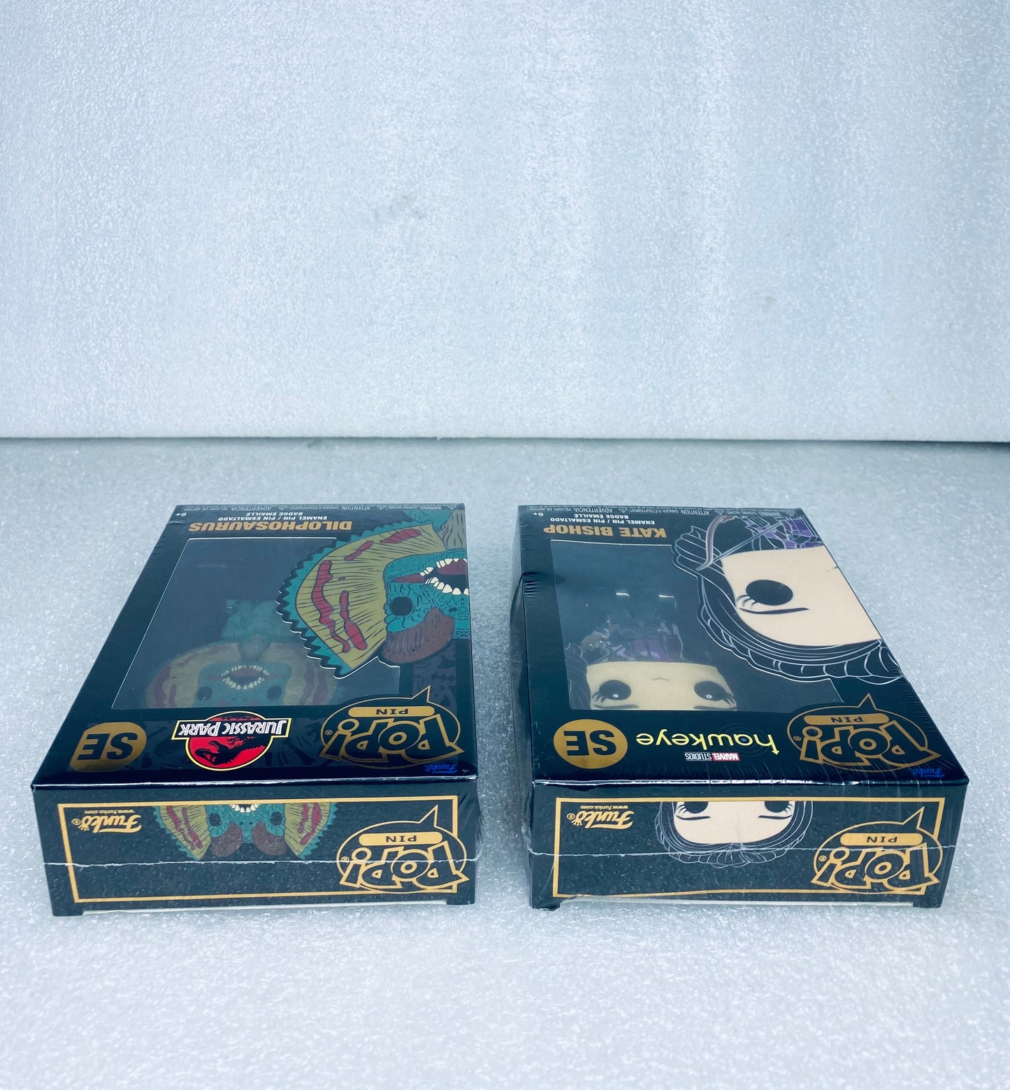 #66 - lot Of 2 - New Funko Pop Pins, Jurassic Park & Marvels Hawkeye - (READ) - (IN CONDITION AS SHOWN)