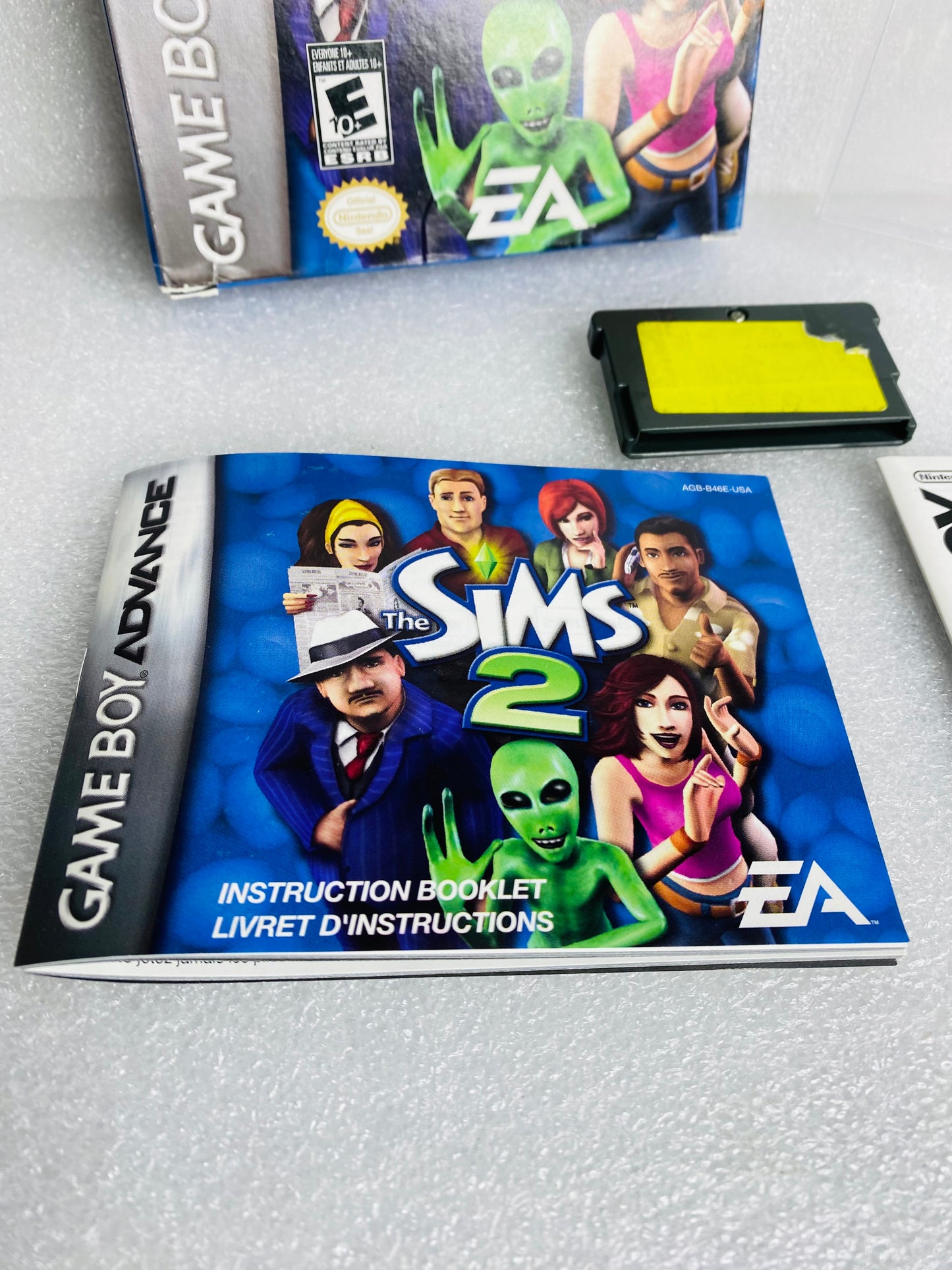 the Sims 2 (Nintendo Game Boy Advance, 2005) W/Plastic Cover - (READ)