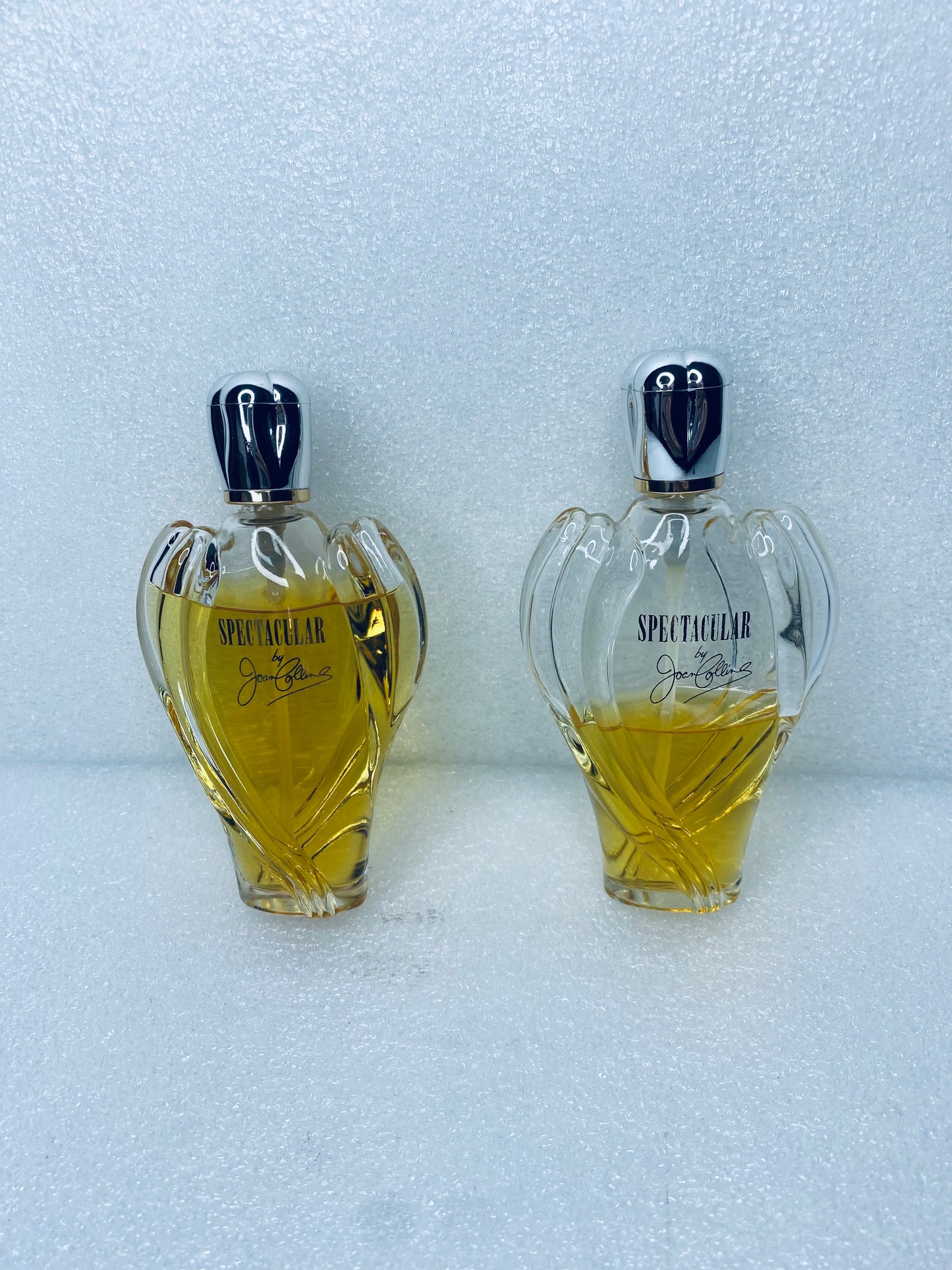 #238 - Lot Of 2 - Spectacular Perfume By Joan Collins - (IN CONDITION AS SHOWN)