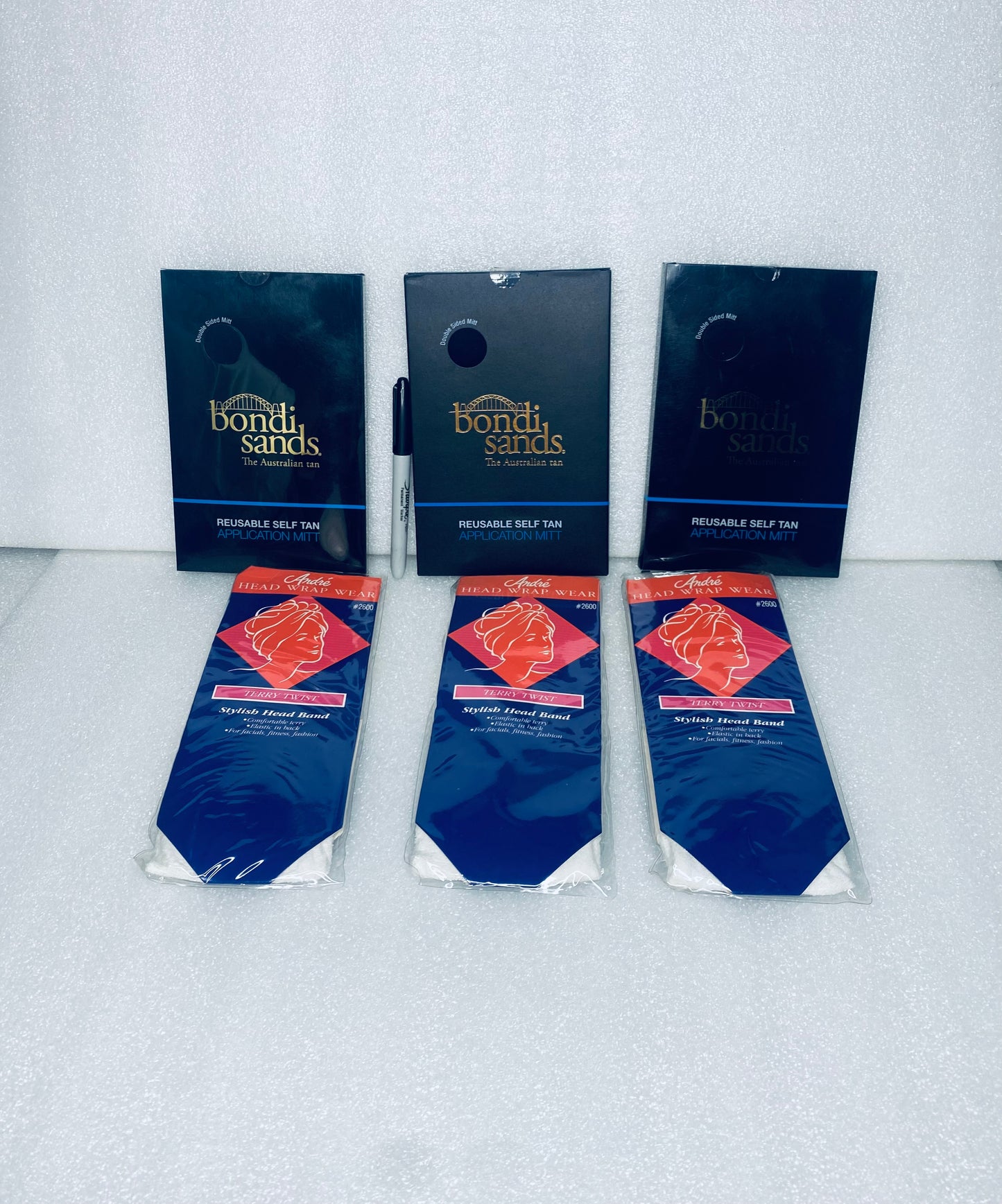 #217 - Lot Of 6 New - (3) Bondi Sands Tan Application Mitt & (3) Andre Terry Twist Stylish Head Band - (AS SHOWN)