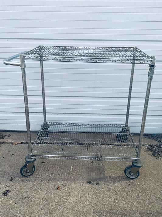 #136 - Stainless Steel Push Cart 2 Tier Adjustable With Casters & Approx. Dimensions: 40” x 41” x 24” - (IN CONDITION AS SHOWN) - (READ)