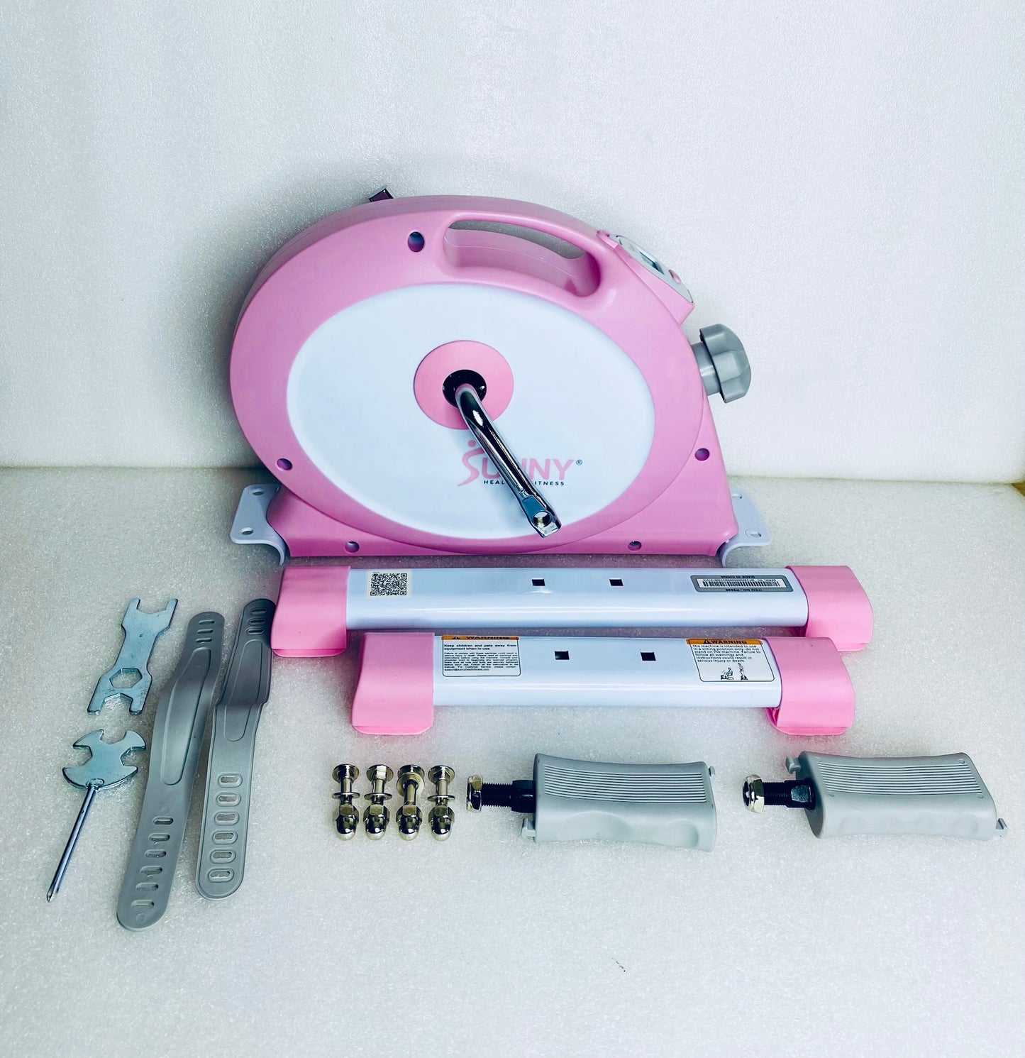 New Other Sunny Health & Fitness Under Desk Smart Mini Exercise Bike, Pink/White