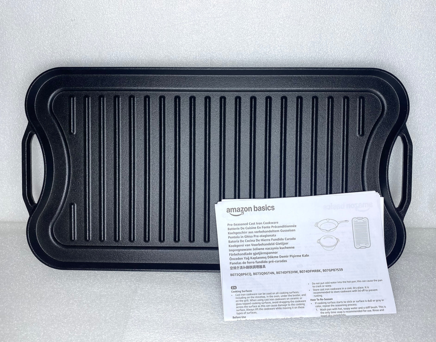 new Other Amazon Basics Pre-Seasoned Cast Iron Reversible Grill, Black - (READ)