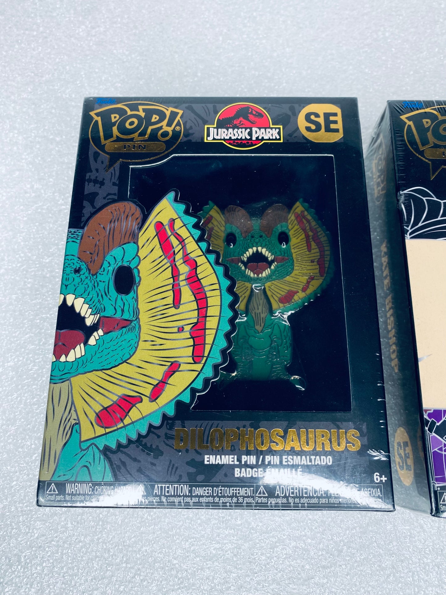 #66 - lot Of 2 - New Funko Pop Pins, Jurassic Park & Marvels Hawkeye - (READ) - (IN CONDITION AS SHOWN)