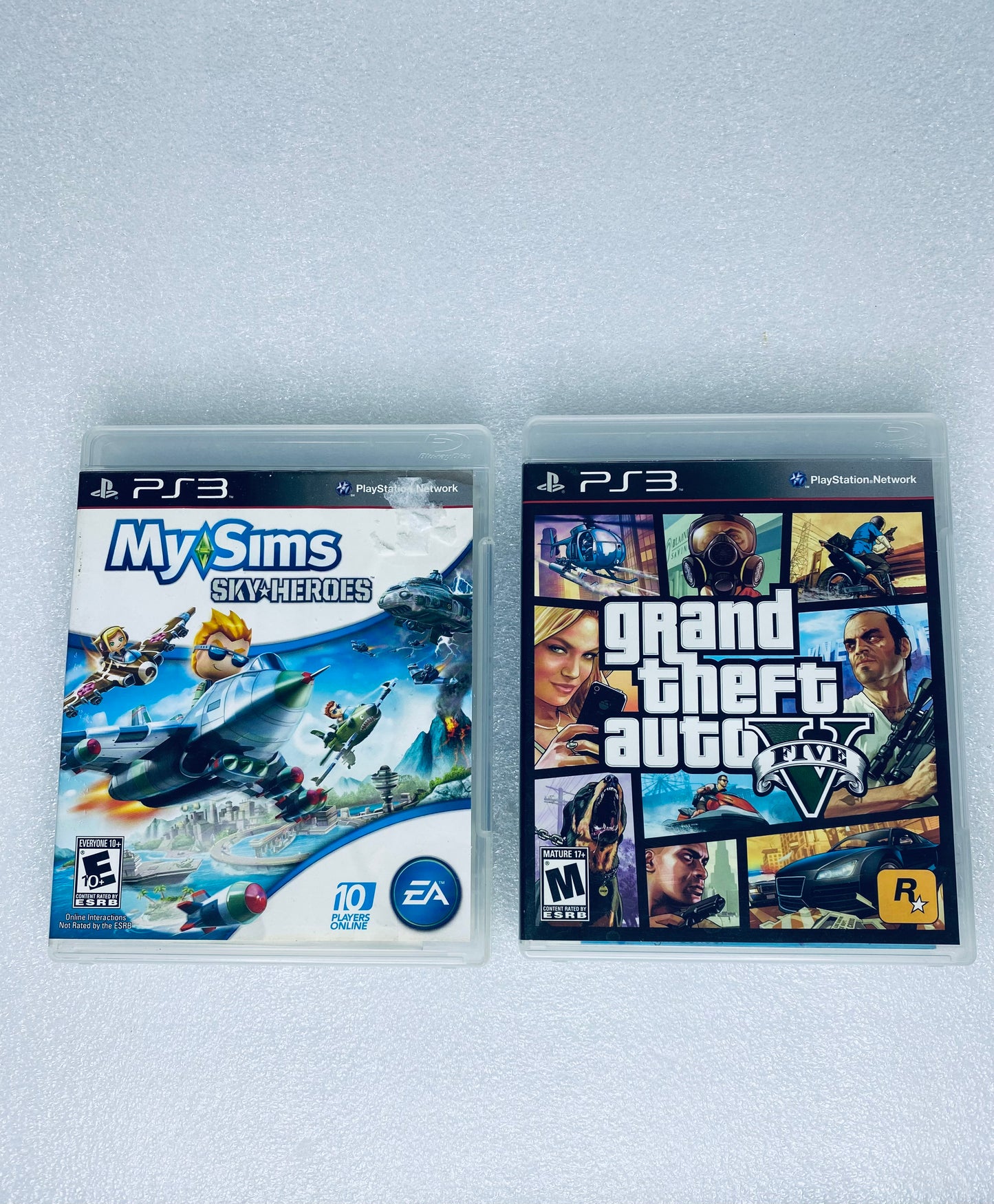 #58 - lot Of 2 -Sony PlayStation 3 Video Games GTA V, My Sims Sky Heroes- (READ) - (IN CONDITION AS SHOWN)