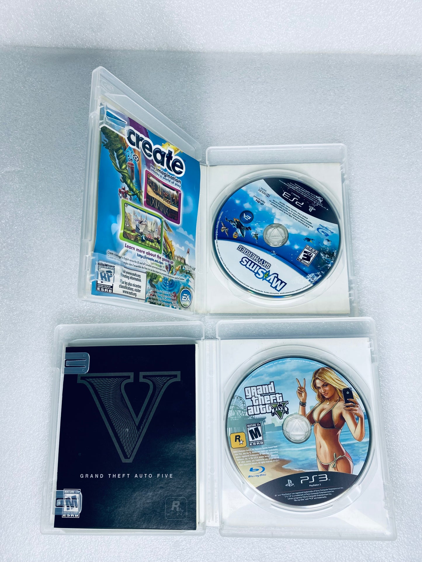 #58 - lot Of 2 -Sony PlayStation 3 Video Games GTA V, My Sims Sky Heroes- (READ) - (IN CONDITION AS SHOWN)