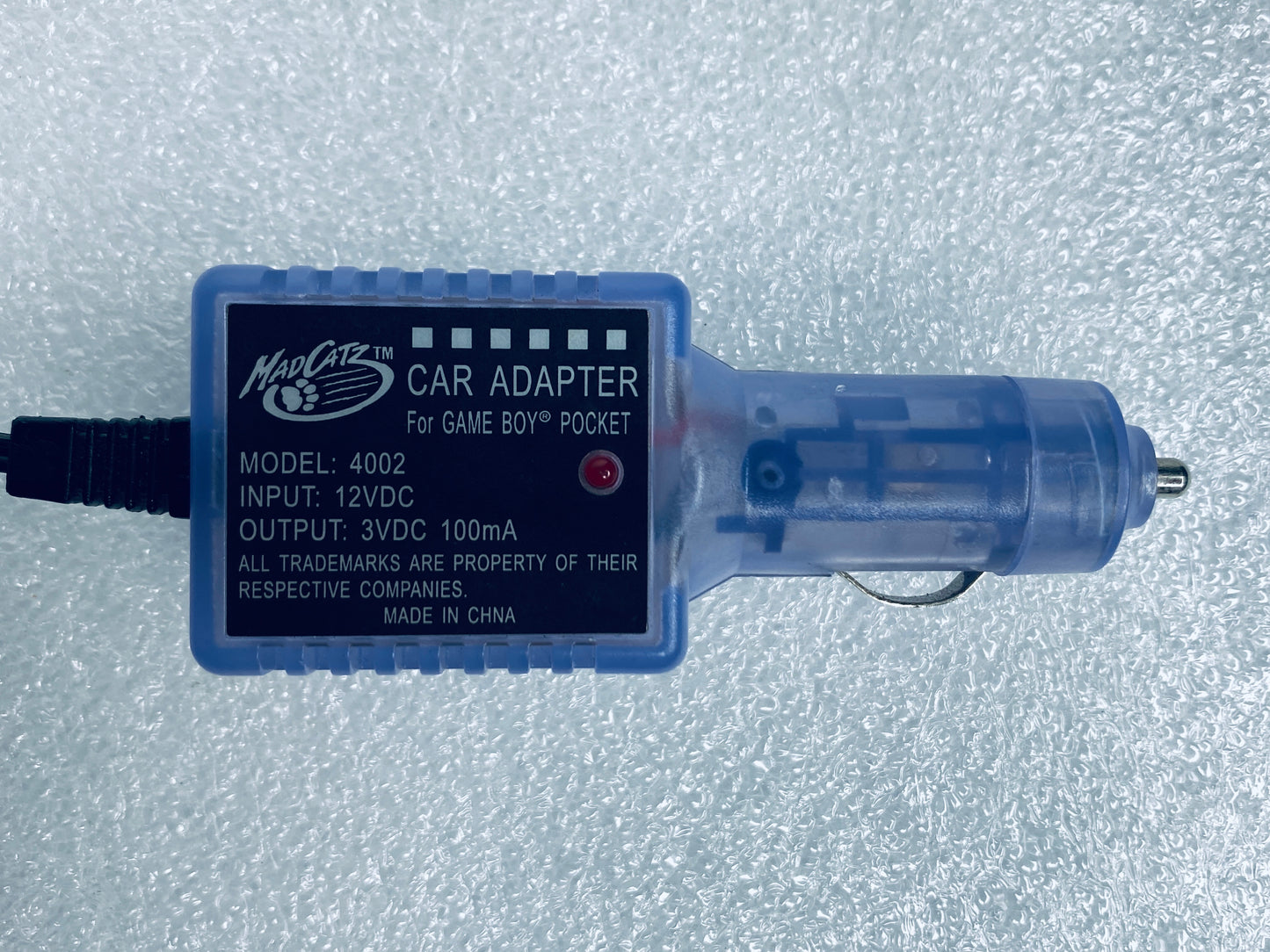 #24 - madCatz Purple Car Adapter For Game Boy Pocket, 4002 - (READ) - (IN CONDITION AS SHOWN)